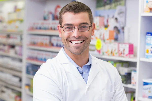 Handsome pharmacist smiling at camera — Stock Photo, Image