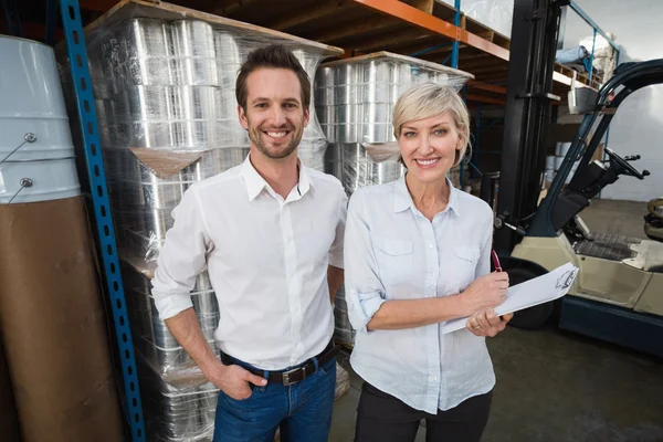 Warehouse managers looking at camera — Stock Photo, Image