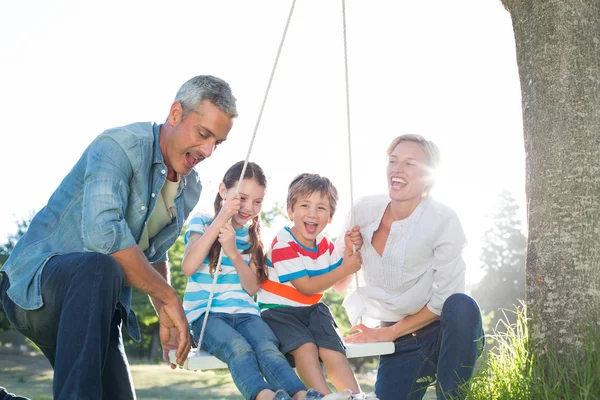 Happy family swing — Stock Photo, Image