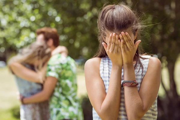 Brunette upset at seeing boyfriend with girl — Stock Photo, Image