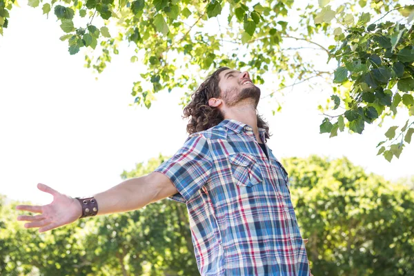 Young man feeling free in the park — Stock Photo, Image