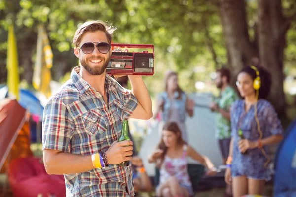 Hipster holding retro cassette player — Stock Photo, Image