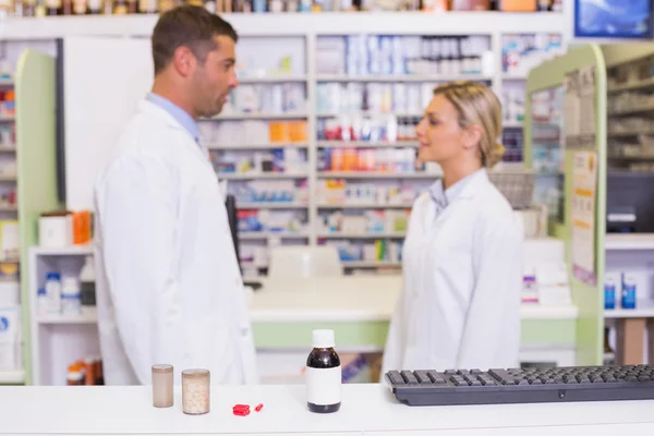 Pharmacists talking each other — Stock Photo, Image