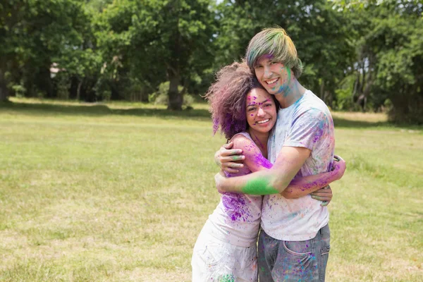 Friends having fun with powder paint — Stock Photo, Image