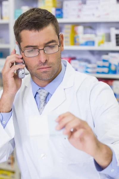 Serious pharmacist on the phone — Stock Photo, Image