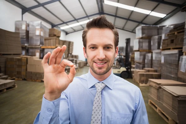 Warehouse manager making okay gesture — Stock Photo, Image