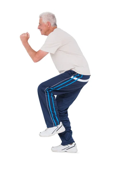 Senior man smiling and working out — Stock Photo, Image