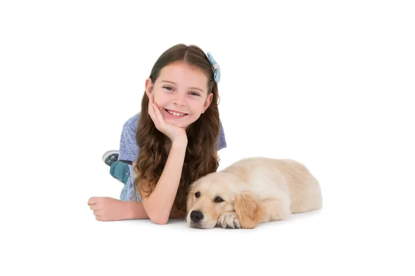 Lying little girl with a dog — Stock Photo, Image