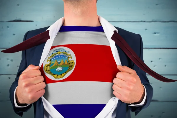 Zakenman opening shirt te onthullen van costa rica vlag — Stockfoto