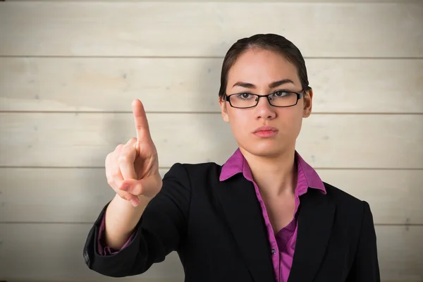 Serious businesswoman pointing — Stock Photo, Image