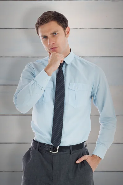 Thoughtful businessman with hand on chin — Stock Photo, Image