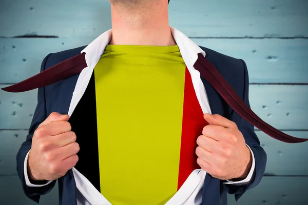 Businessman opening shirt to reveal belgium flag — Stock Photo, Image