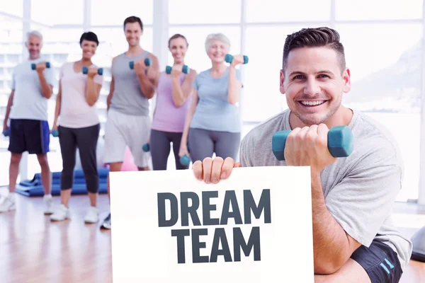 Class exercising with dumbbells in gym — Stock Photo, Image