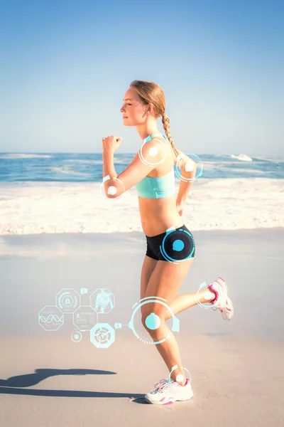 Kompositbild der fitten Blondine beim Joggen am Strand — Stockfoto