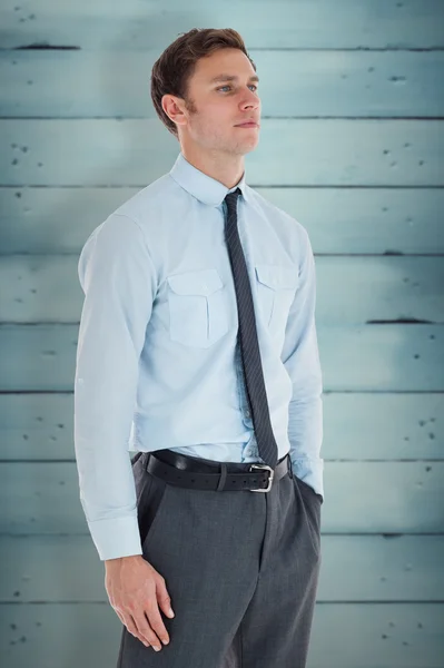 Businessman standing with hand in pocket — Stock Photo, Image