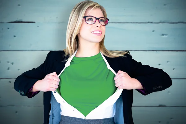 Businesswoman opening shirt in superhero style — Stock Photo, Image