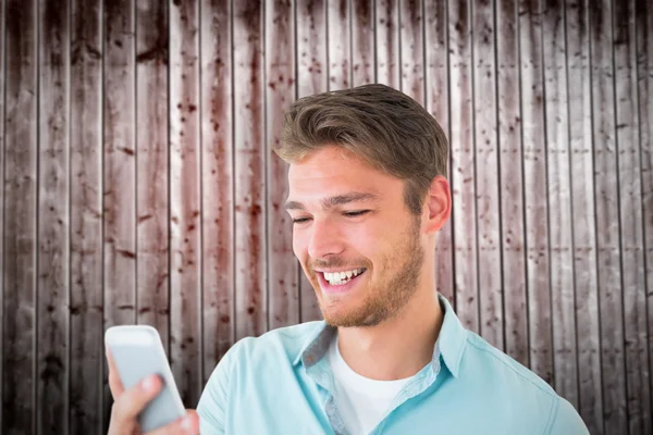 Young man using his smartphone — Stock Photo, Image