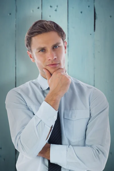 Thinking businessman with hand on chin — Stock Photo, Image