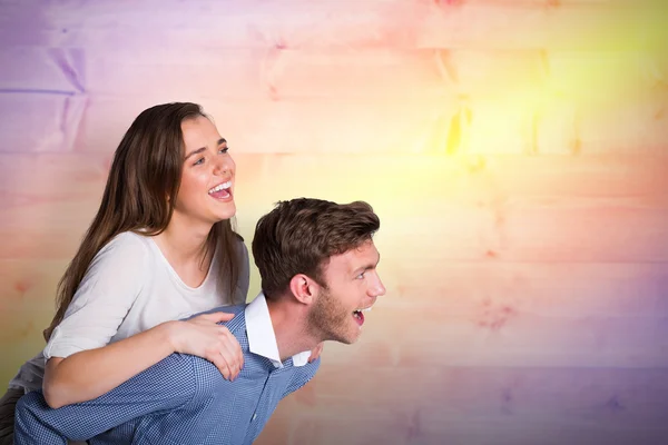 Young man carrying woman — Stock Photo, Image