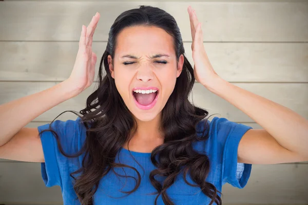 Angry brunette shouting at camera — Stock Photo, Image