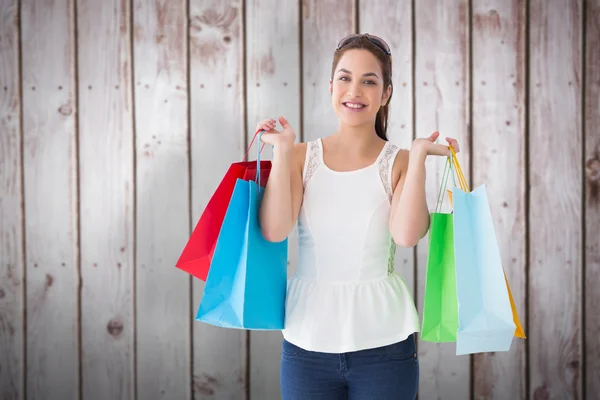 Brown hair holding shopping bags Royalty Free Stock Photos