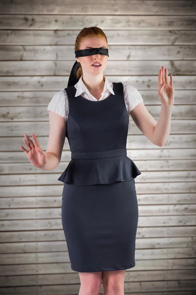 Redhead businesswoman in a blindfold — Stock Photo, Image