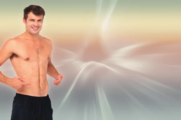 Fit shirtless man smiling at camera — Stock Photo, Image