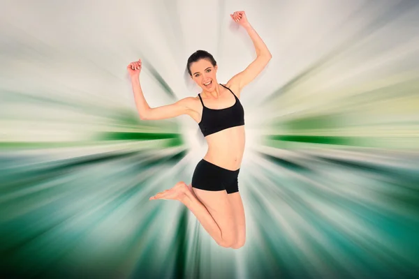 Sporty young woman jumping — Stock Photo, Image