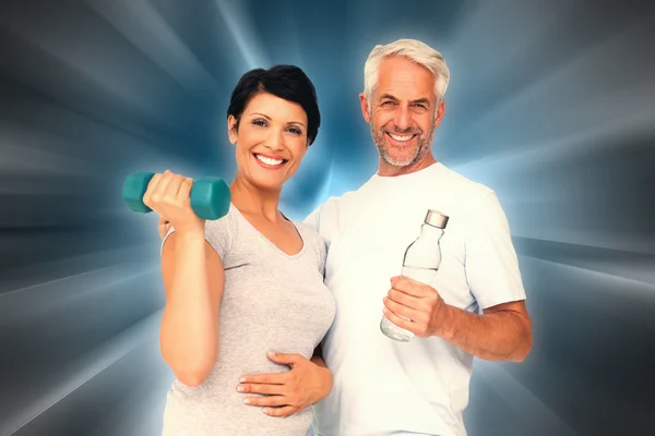 Happy fit couple with dumbbell — Stock Photo, Image