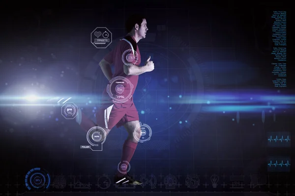 Jucător de fotbal în alergare roșie — Fotografie, imagine de stoc