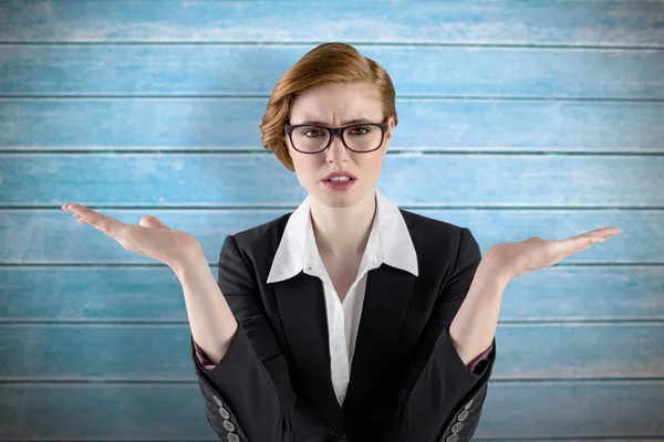 Businesswoman holding hand out in presentation — Stock Photo, Image