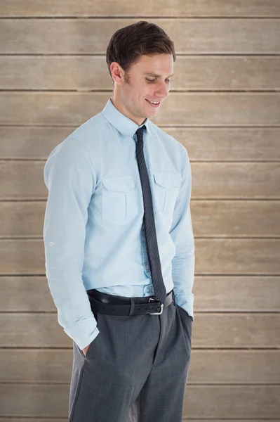Businessman standing with hand in pocket — Stock Photo, Image