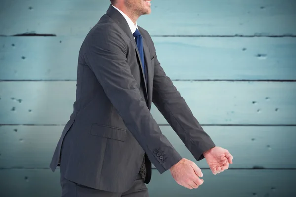 Businessman holding something with his hands — Stock Photo, Image