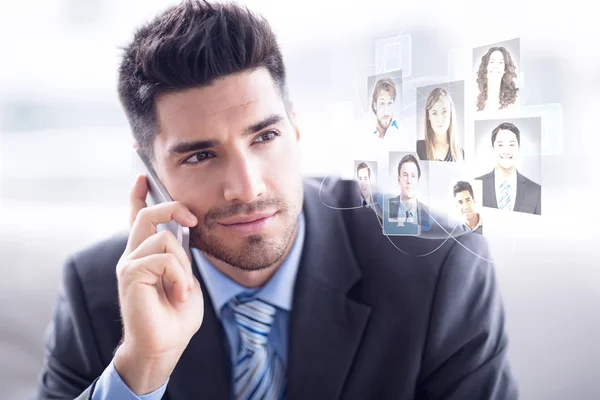 Handsome businessman sitting on sofa — Stock Photo, Image