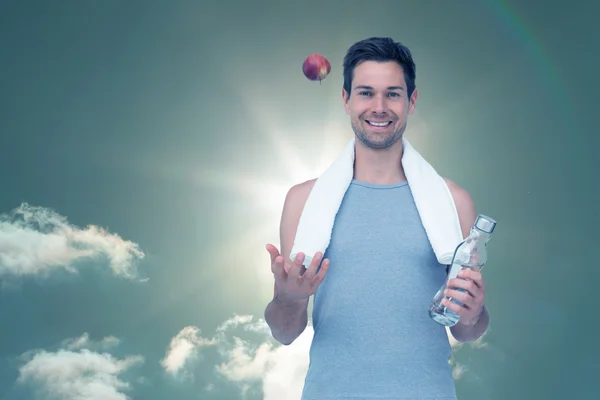 Senior man with water bottle against sky — Stock Photo, Image