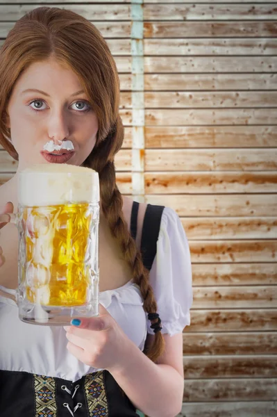 Oktoberfest girl drinking jug of beer — Stock Photo, Image