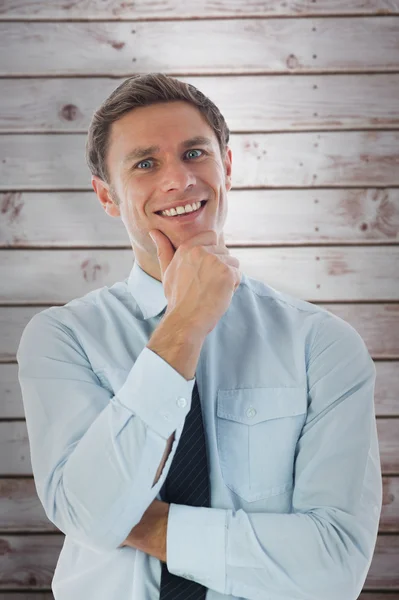 Denkender Geschäftsmann mit der Hand am Kinn — Stockfoto