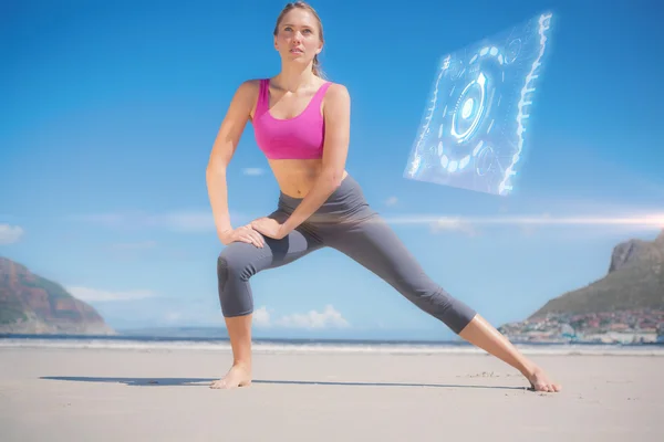 Focused fit blonde warming up on beach — Stock Photo, Image