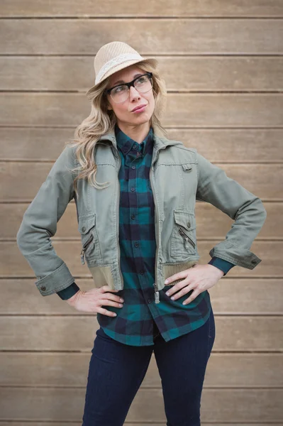 Pretty blonde against wooden planks — Stock Photo, Image