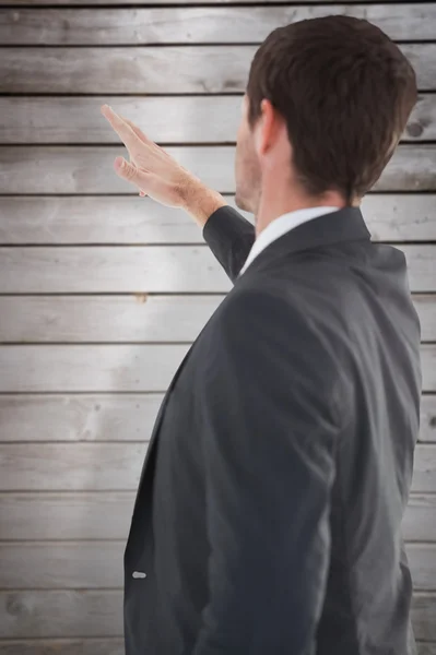 Focused businessman standing and pointing — Stock Photo, Image