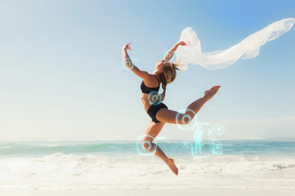 Blonde jumping gracefully with scarf — Stock Photo, Image