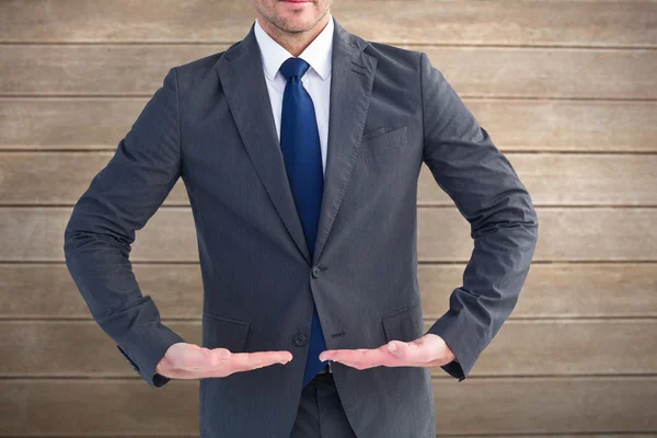 Businessman standing with hands out — Stock Photo, Image
