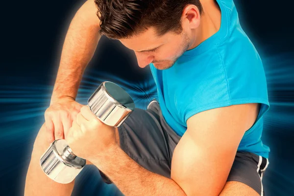 Fit man exercising with dumbbell — Stock Photo, Image