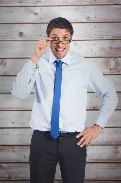 Thinking businessman tilting glasses — Stock Photo, Image