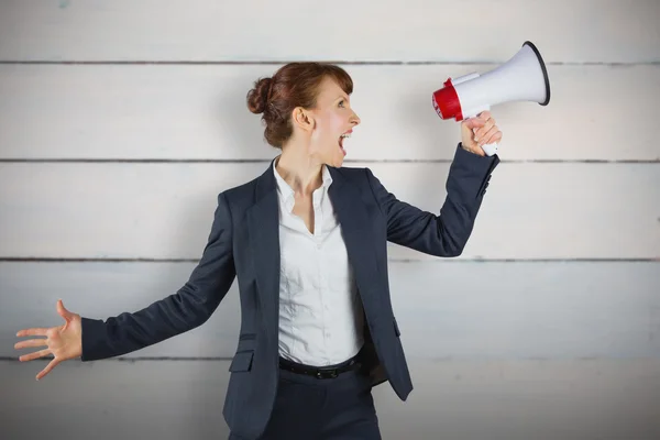 Businesswoman with loudspeaker — Stock Photo, Image