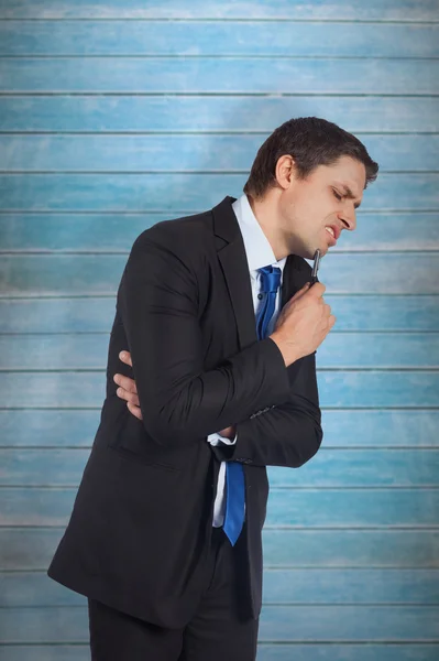 Thinking businessman holding pen — Stock Photo, Image