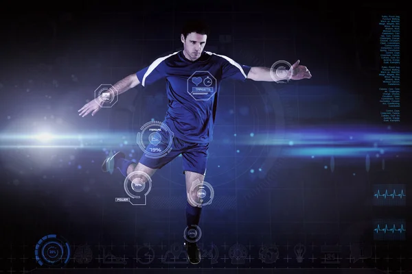 Složený obrázek fotbalista v modré kopal — Stock fotografie
