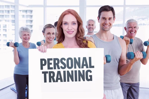 Pretty redhead showing a card — Stock Photo, Image