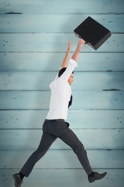 Businessman leaping with his briefcase — Stock Photo, Image