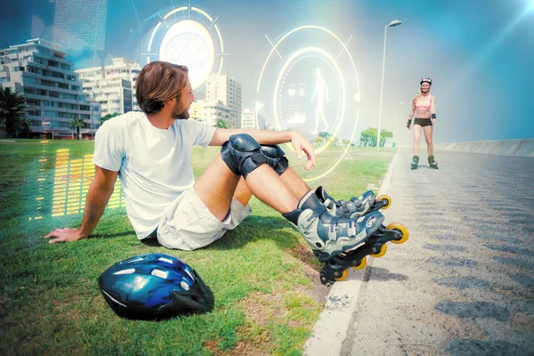 Fit man getting ready to roller blade — Stock Photo, Image